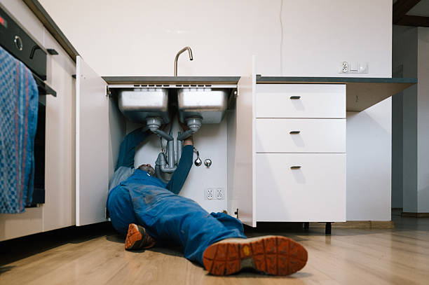 Professional Drain Cleaning technician working in Hawkeye, IA